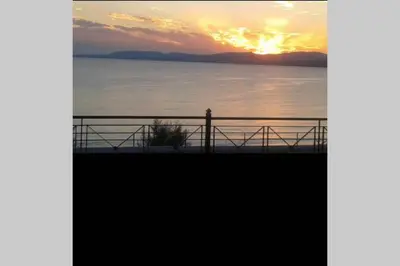 a view of a sunset over the water at Villa Tsampika in Pefki Rhodes