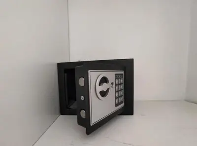 a black and white microwave sitting on a wall at Afroditi Superior Apartments in Archangelos