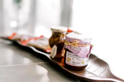 a tray with two jars of honey on a table at Mike's Studios in Haraki