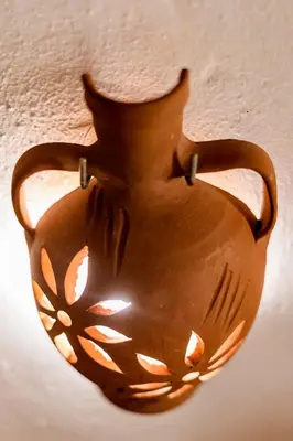 a brown vase is hanging on a wall at Hara's Traditional Detached House in Malona in Malona Village