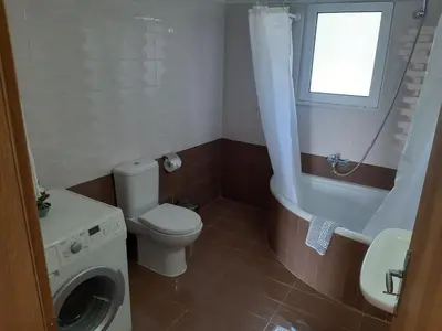 a bathroom with a toilet and a tub and a sink at Katerina Villa In Kiotari in Kiotari