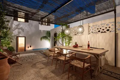 a dining room with a table and chairs at Lindian Plumeria in Líndos
