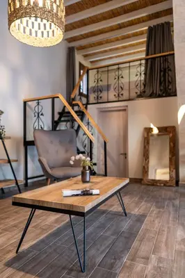 a living room with a coffee table and a chair at Casa di Giorgio in Kattavía