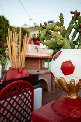 a vase with a soccer ball on top of a table at Margarita luxury apartment 1 in Faliraki