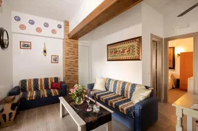 a living room with a couch and a table at Margarita luxury apartment 1 in Faliraki