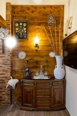 a room with a tv and a wooden wall at Margarita luxury apartment 1 in Faliraki