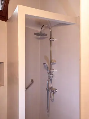a shower with a shower head in a bathroom at Casa Theano - Old Town in Rhodes Town