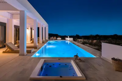 a swimming pool in the middle of a house at Seawater Villa - Luxury Pool Retreat - 150m Beach in Lachania