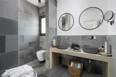 a bathroom with two sinks and a mirror at Seawater Villa - Luxury Pool Retreat - 150m Beach in Lachania