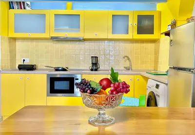 a bowl of fruit on a table in a kitchen at Seafront - Harbour view , Pitini 2 in Symi