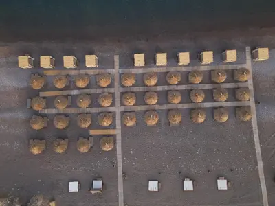 an overhead view of a bunch of tables and chairs at Seashore Villa - Luxury Beachfront - Pool & Sea View in Lachania