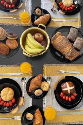 a table topped with plates of food and fruit at Casa de Manu in Rhodes Town
