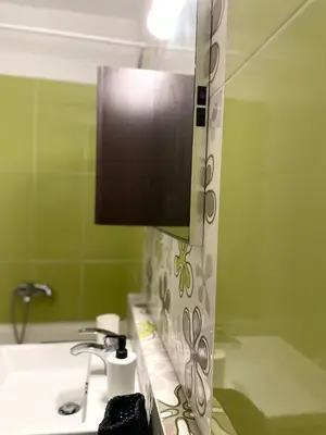 a bathroom with a sink and a mirror at Casa de Manu in Rhodes Town