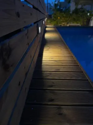 a wooden walkway leading down to a swimming pool at Casa de Manu in Rhodes Town