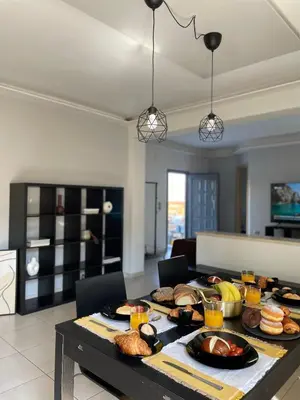a table with food on it in a living room at Casa de Manu in Rhodes Town