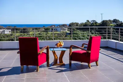 two chairs and a table on a roof at Villa de Manu in Rhodes Town
