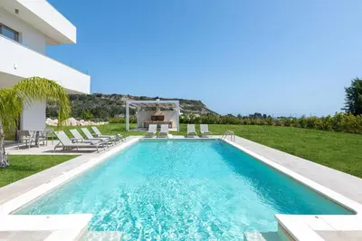 a swimming pool in the backyard of a villa at Pantheon Luxury Villas Rhodes Island in Afantou