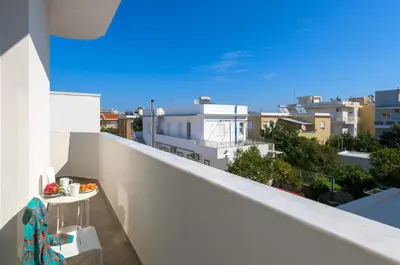 a balcony with a view of a city at Lucian City Apartments in Rhodes Town