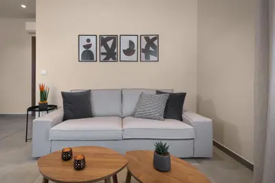 a living room with a couch and a table at Lucian City Apartments in Rhodes Town