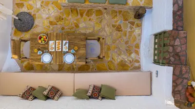 a model of a kitchen with pillows in front of a wall at Villa Phaedra in Halki