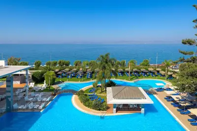 an aerial view of the pool at a resort at Oceanis Beach Hotel in Ixia