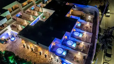 an overhead view of a building with blue lights at CASA MIKELE by Sarikas - SEA SIDE SUITES and STUDIOS -adults only in Faliraki