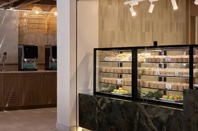 a bakery with a display case filled with food at Atlantica Aegean Blue in Kolimbia
