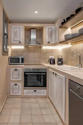 a kitchen with a sink and a stove at Melitia Traditional House in Koskinou