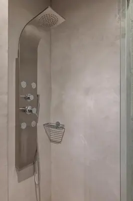a shower with a glass door in a bathroom at Melitia Traditional House in Koskinou