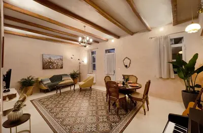 a living room with a table and a couch at Casa Emiliana in Rhodes Town