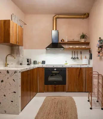 a kitchen with a black stove and a sink at Casa Emiliana in Rhodes Town