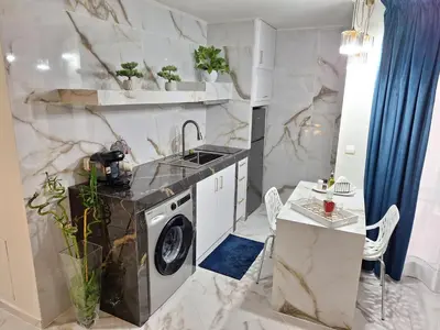 a kitchen with a sink and a washing machine at Modern Quiet Apartment in the Center of Rhodes in Rhodes Town