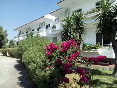 a house with flowers in front of it at Asterias Bay-Theologos in Theologos