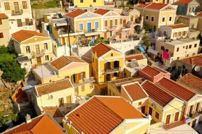 an aerial view of a town with houses at Mary's dreams Villa in Symi