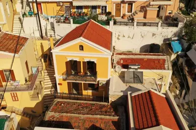 an overhead view of a city with buildings at Mary's dreams Villa in Symi
