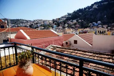 a view of a city from a balcony at Mary's dreams Villa in Symi