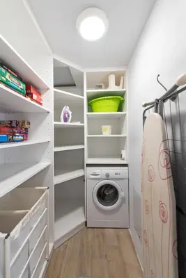 a laundry room with a washer and dryer at Ritas Modern In-City House in Rhodes Town