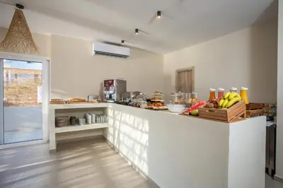 a kitchen with a counter with bananas on it at Atma Beach Rooms & Suites in Faliraki