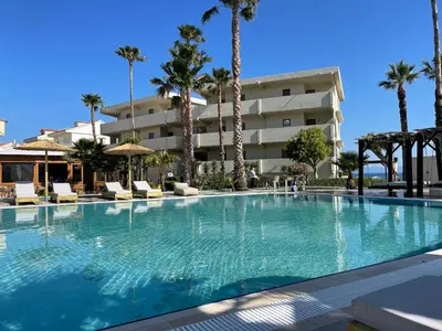 a large swimming pool in front of a hotel at Ixia Dream hotel - Adults only in Ixia