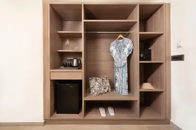 a dress on a shelf in a room at Ixia Dream hotel - Adults only in Ixia