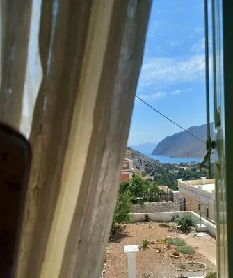 a view from a window of a city at Zoe Apartments in Symi