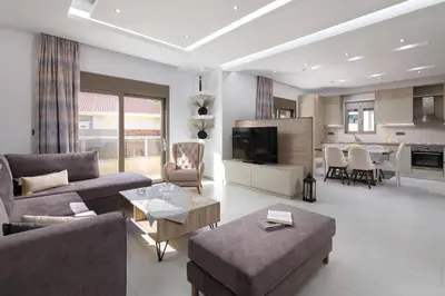 a living room with a couch and a table at Panthea Luxury Villa in Triánta