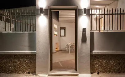 a hallway with a glass door leading to a staircase at Onirico House in Rhodes Town