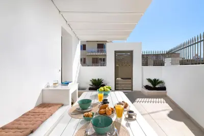 a room with a table with food on it at Onirico House in Rhodes Town