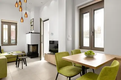 a kitchen and living room with a table and chairs at Onirico House in Rhodes Town