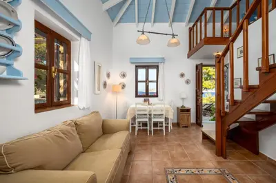 a living room with a couch and a table at Villa Ftenagia in Halki