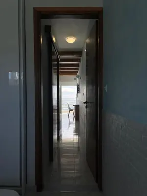 a hallway with a door leading to a room at Skizenas Waterfront Apartments in Haraki