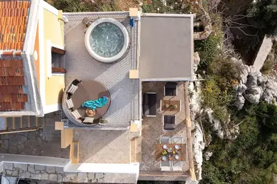 an overhead view of a swimming pool and a house at Sea La Vie Villa Symi in Symi