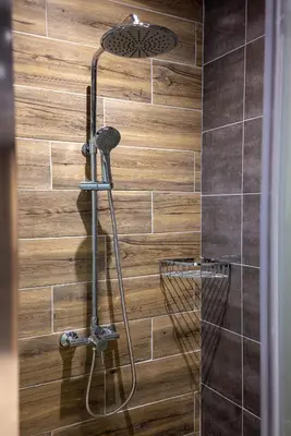 a shower with a shower head in a bathroom at Maria's Luxurious Villa in Koskinou in Koskinou