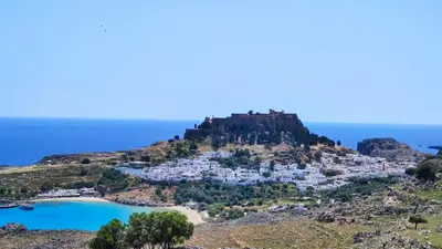 a view of a small island on a hill at Heliophilia Lindos in Líndos